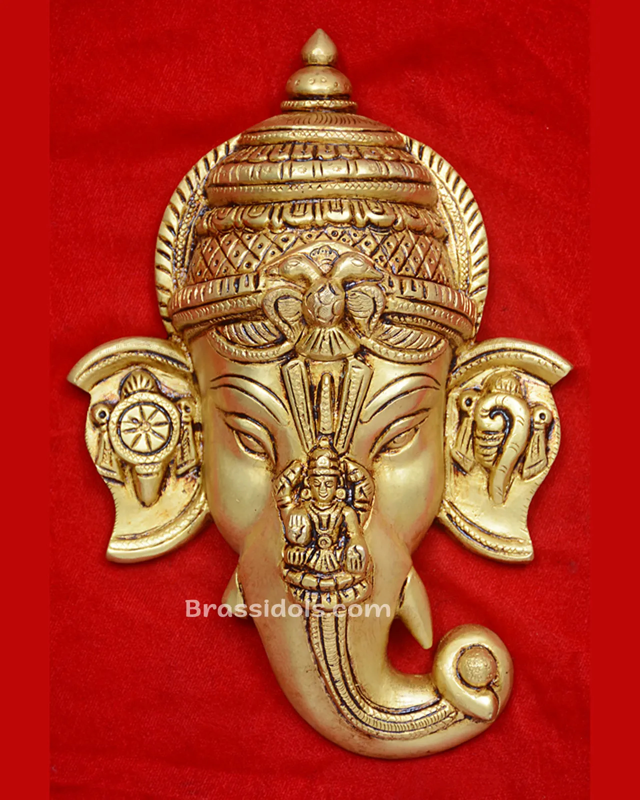 Ganesh Head with Devi and shank Chakra
