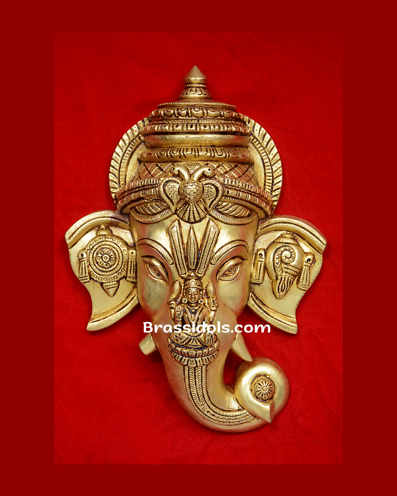 Ganesh Head with Devi and shank Chakra